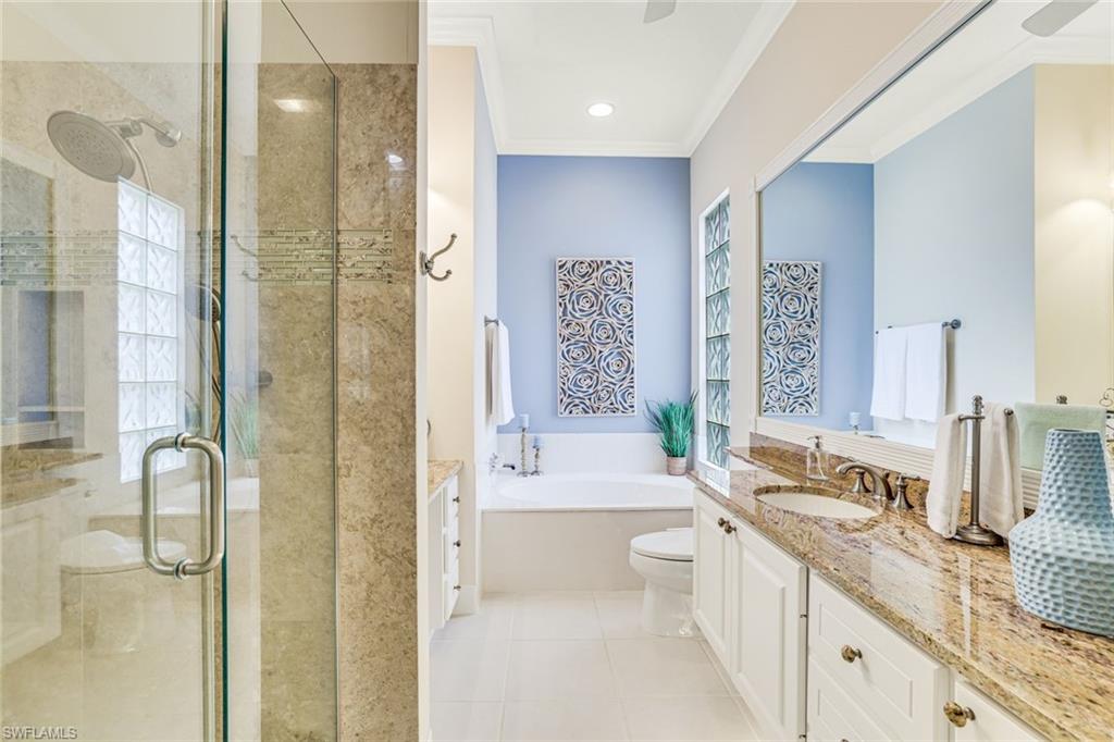 4796 Martinique Way Naples, FL 34119 - Photo 10 of 21 Primary bathroom, with tub, shower and attached secondsry bath