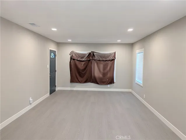 a kitchen with a refrigerator stove and sink
