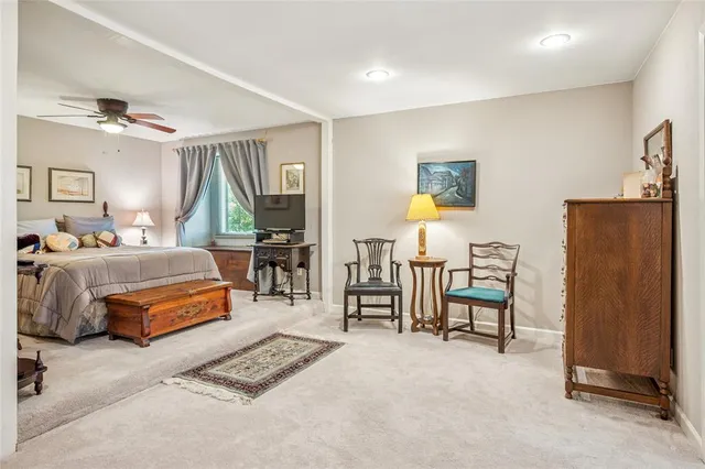 a bedroom with furniture and a window