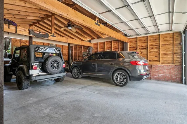 a view of a garage with cars