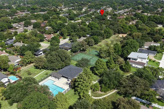 an aerial view of residential house with an outdoor space and street view