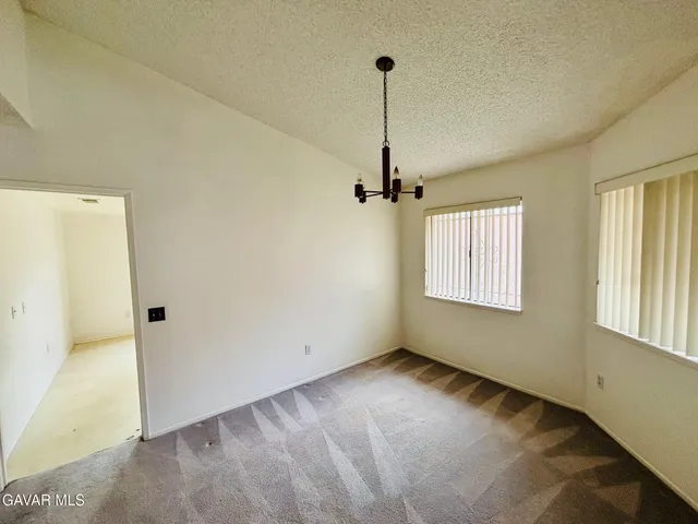 a view of empty room with windows