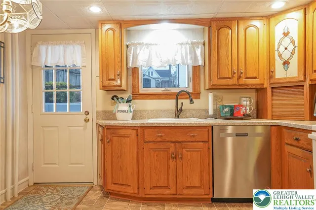 a kitchen with stainless steel appliances granite countertop a stove and a refrigerator
