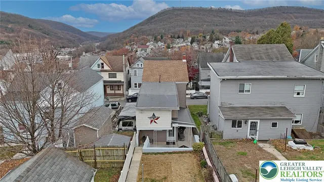 an aerial view of a house with a garden