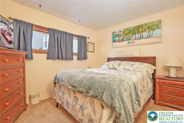 a bathroom with a sink a toilet and shower curtain