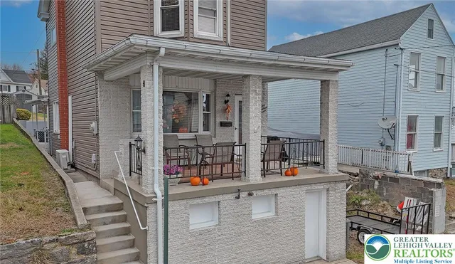 front view of house with a outdoor seating