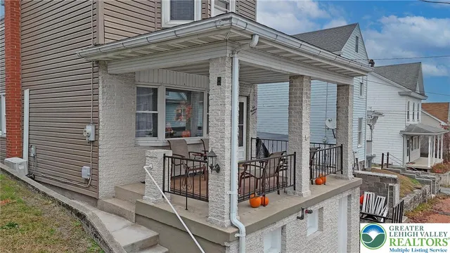 a view of a balcony with chairs