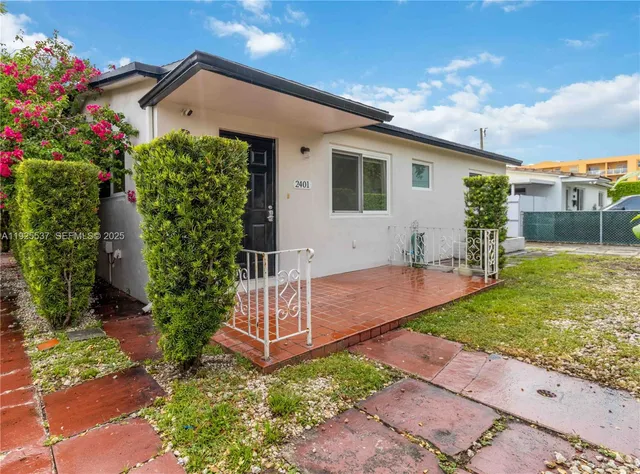 a front view of house with garden