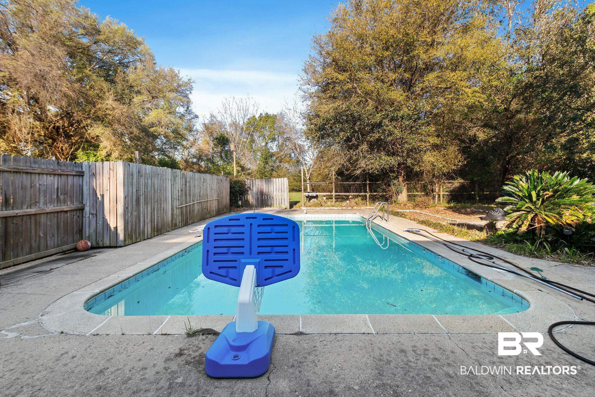 3864 Leroy Stevens Road Mobile, AL 36619 - Photo 28 of 33 View of swimming pool featuring a fenced backyard and patio surround