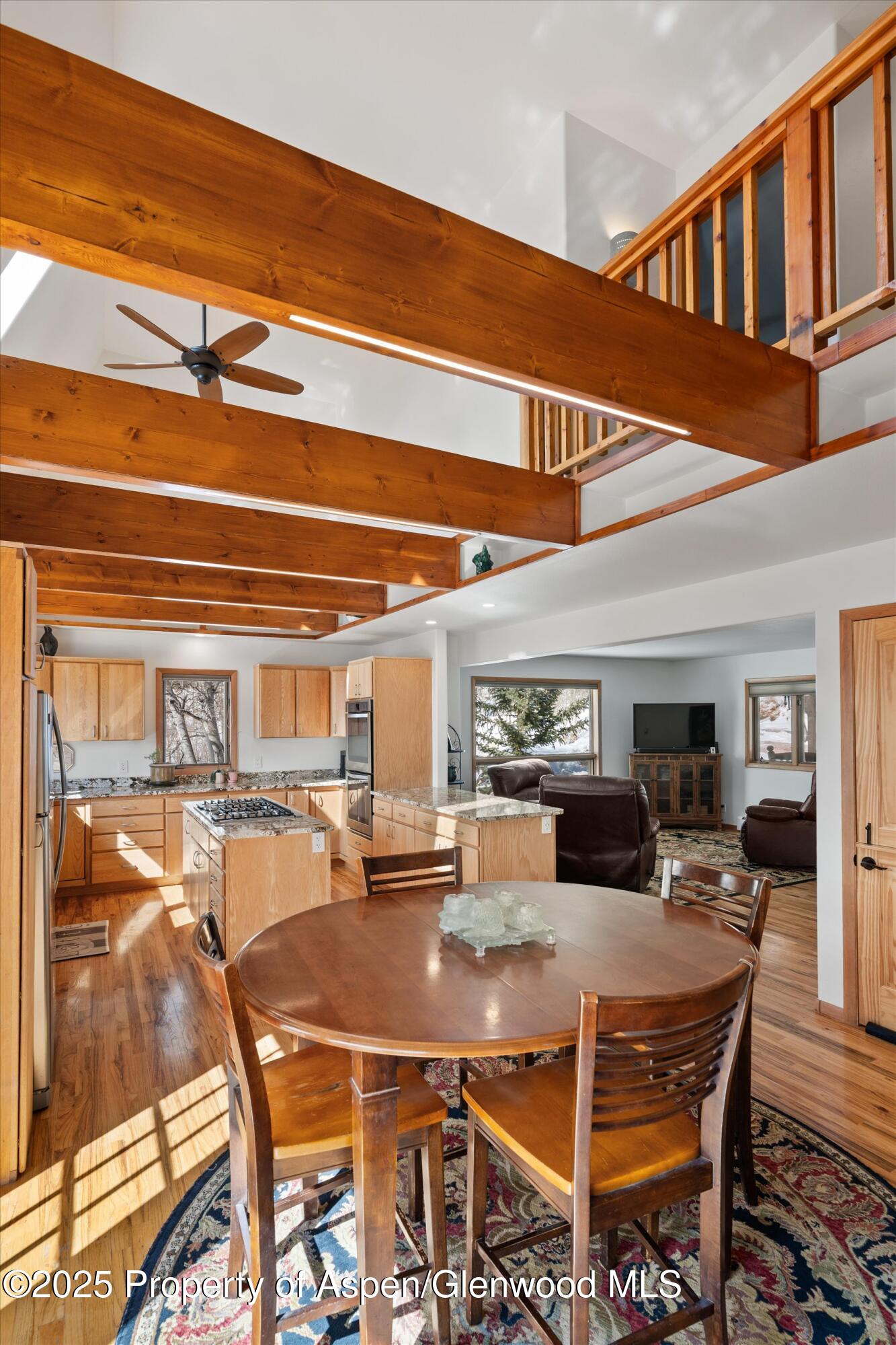 238 Hawk Lane Basalt, CO 81621 - Photo 21 of 46 a view of a dining room with furniture and a chandelier