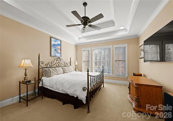 a bed room with a bed and a window