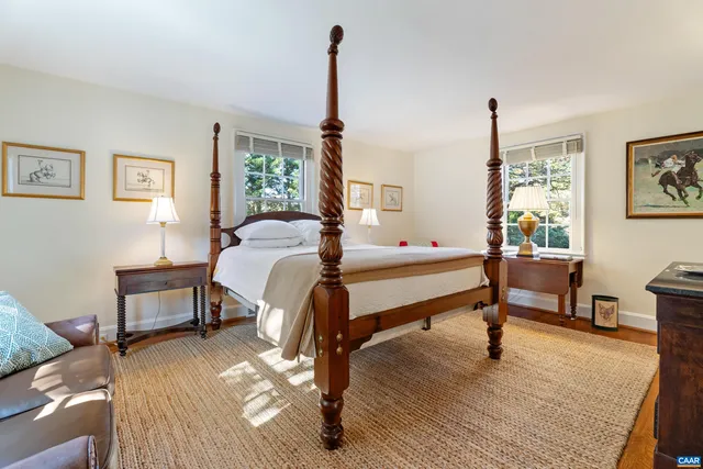 a bedroom with furniture and a window