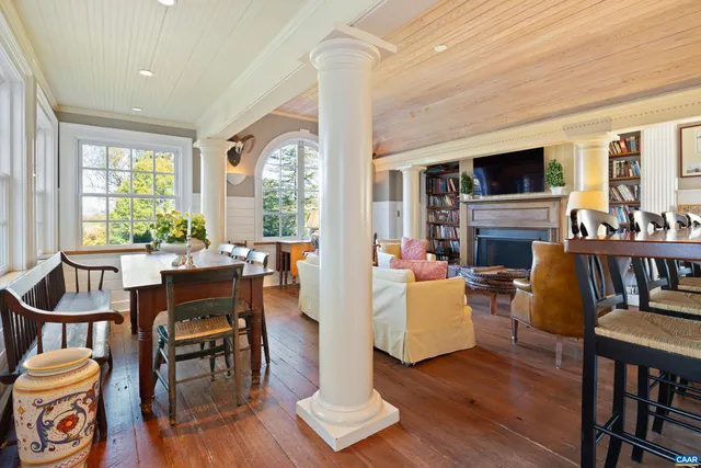 a living room with fireplace furniture and a flat screen tv