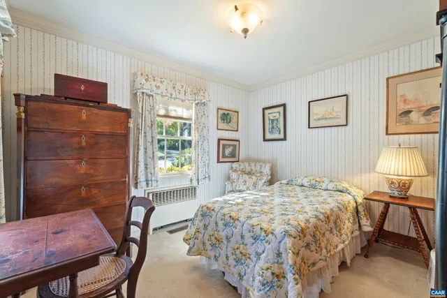 a bedroom with a bed and a table in it