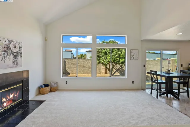 a workspace with furniture and a fireplace