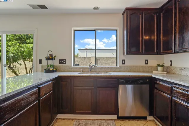 a kitchen with a sink and a window