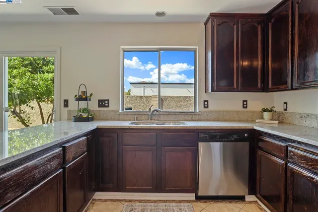 a kitchen with a sink and a window