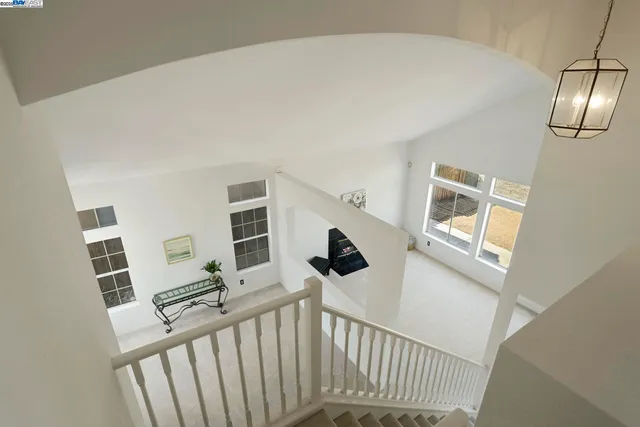 a view of a hallway with windows