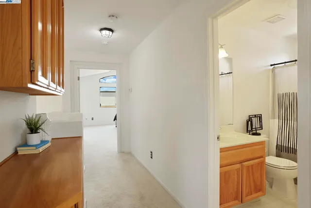 a bathroom with a toilet sink and shower