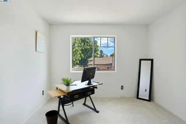 a workspace with furniture and a window