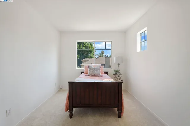 a room with a table chair and a window