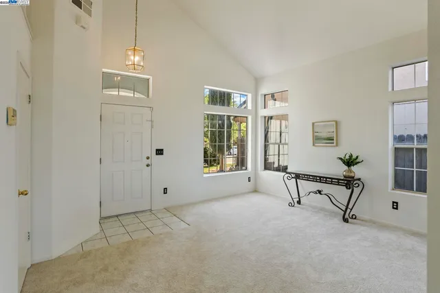 a view of an empty room with windows