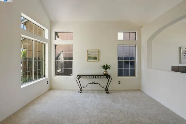 a view of a livingroom with furniture and windows