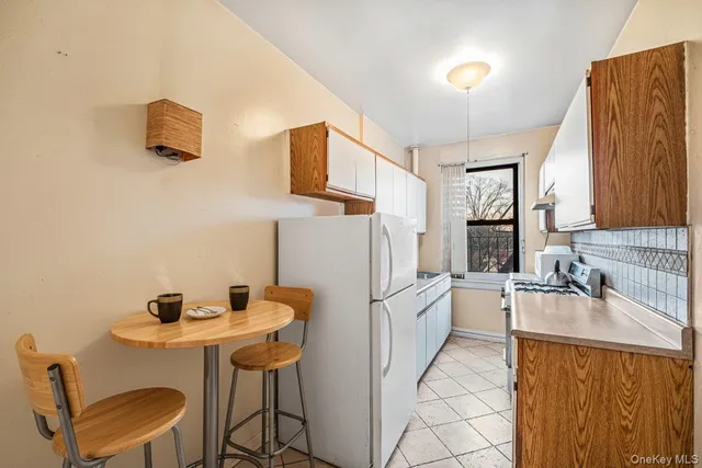 a kitchen with a sink cabinets and appliances