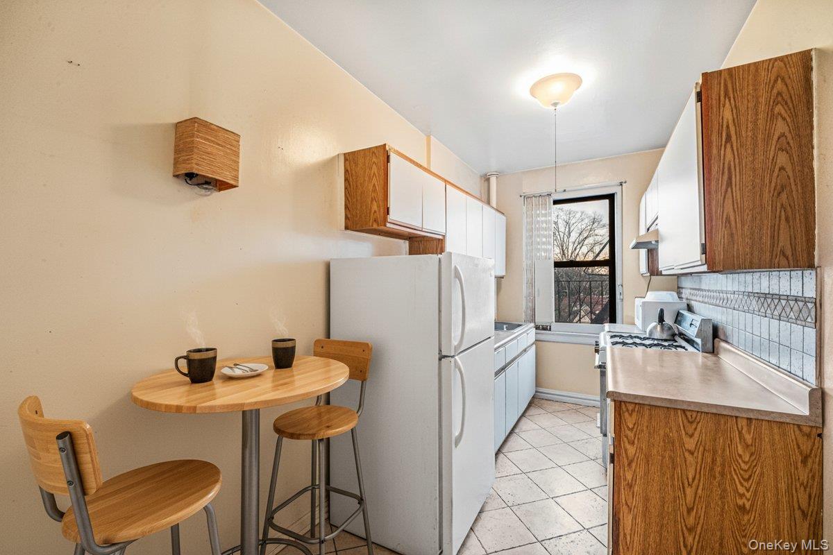 77-16 Austin Street, Unit 5L Queens, NY 11375 - Photo 6 of 13 a kitchen with a sink cabinets and appliances