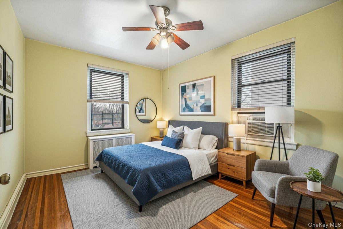 77-16 Austin Street, Unit 5L Queens, NY 11375 - Photo 7 of 13 a bedroom with a bed couch and a window