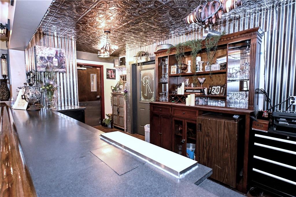 807 Dry Run Road Monongahela, PA 15063 - Photo 8 of 50 Gorgeous Wood Rail on Bar and Display in Back w/ Door to Kitchen and side door to Dining area