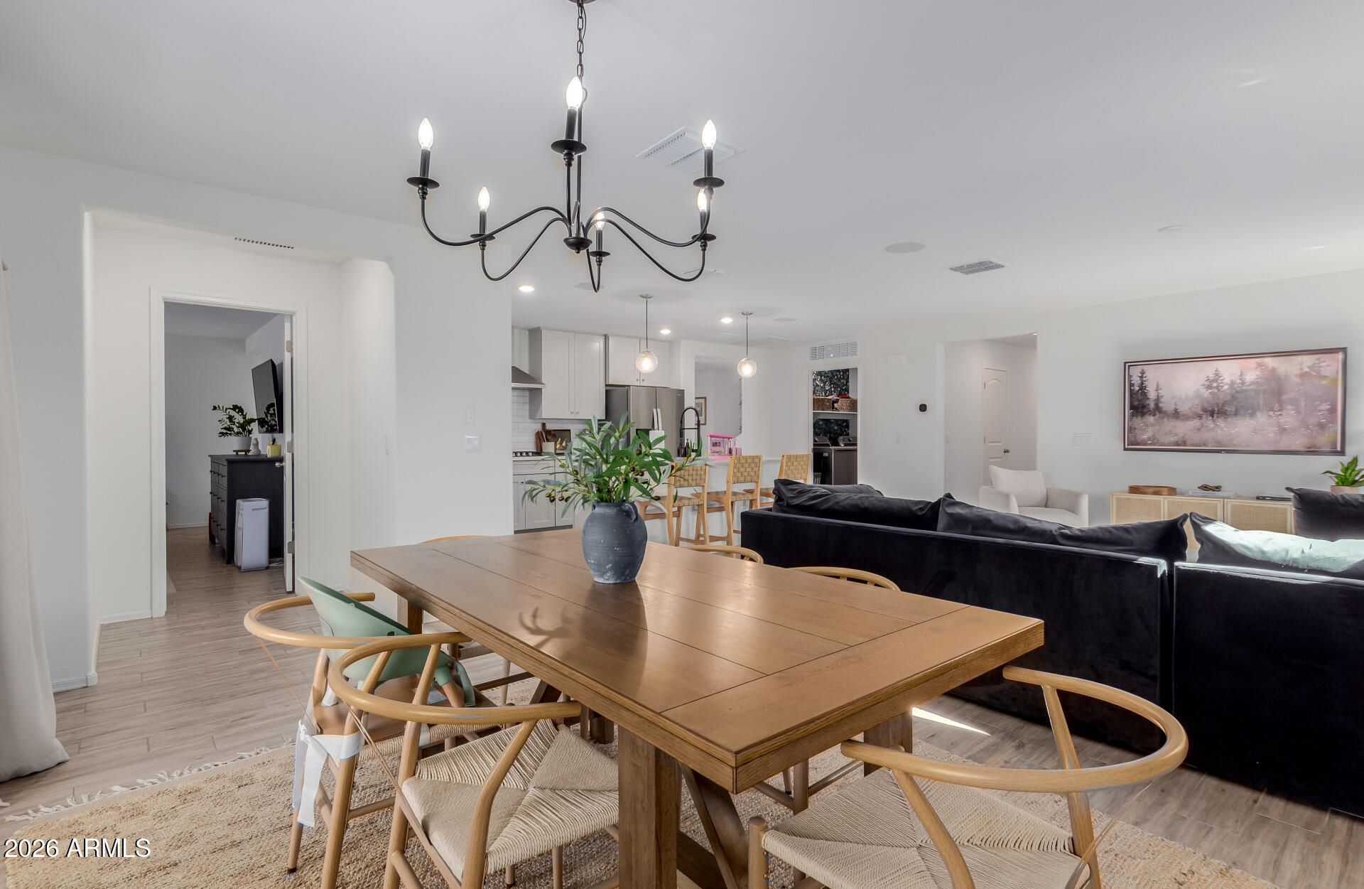 4702 South Riata Street Gilbert, AZ 85297 - Photo 10 of 31 a view of a dining room with furniture and wooden floor