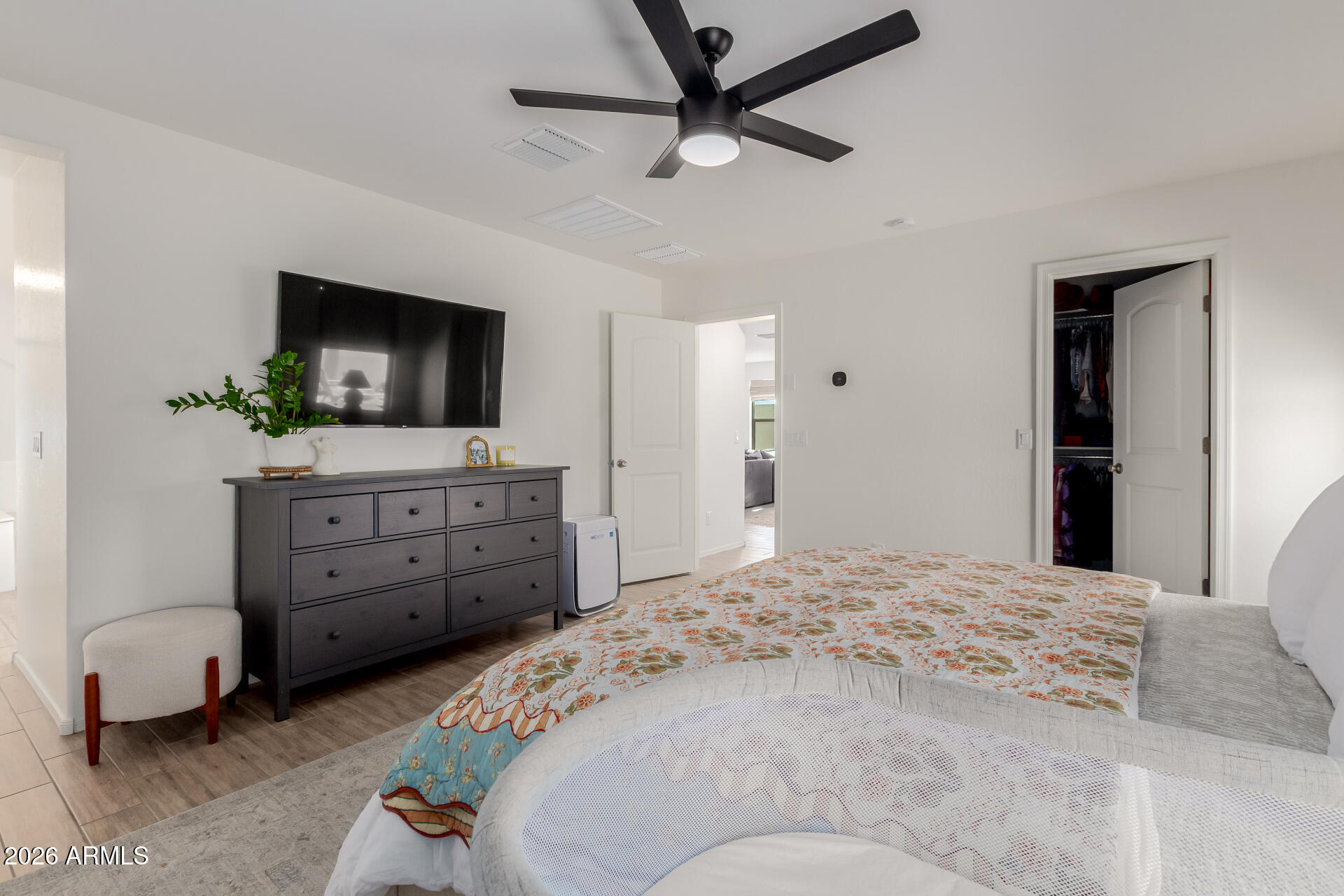 4702 South Riata Street Gilbert, AZ 85297 - Photo 15 of 31 a bedroom with a bed and a flat screen tv