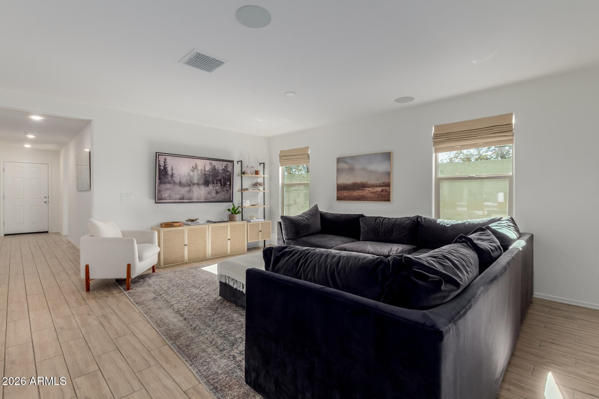 4702 South Riata Street Gilbert, AZ 85297 - Photo 7 of 31 a living room with furniture and a wooden floor