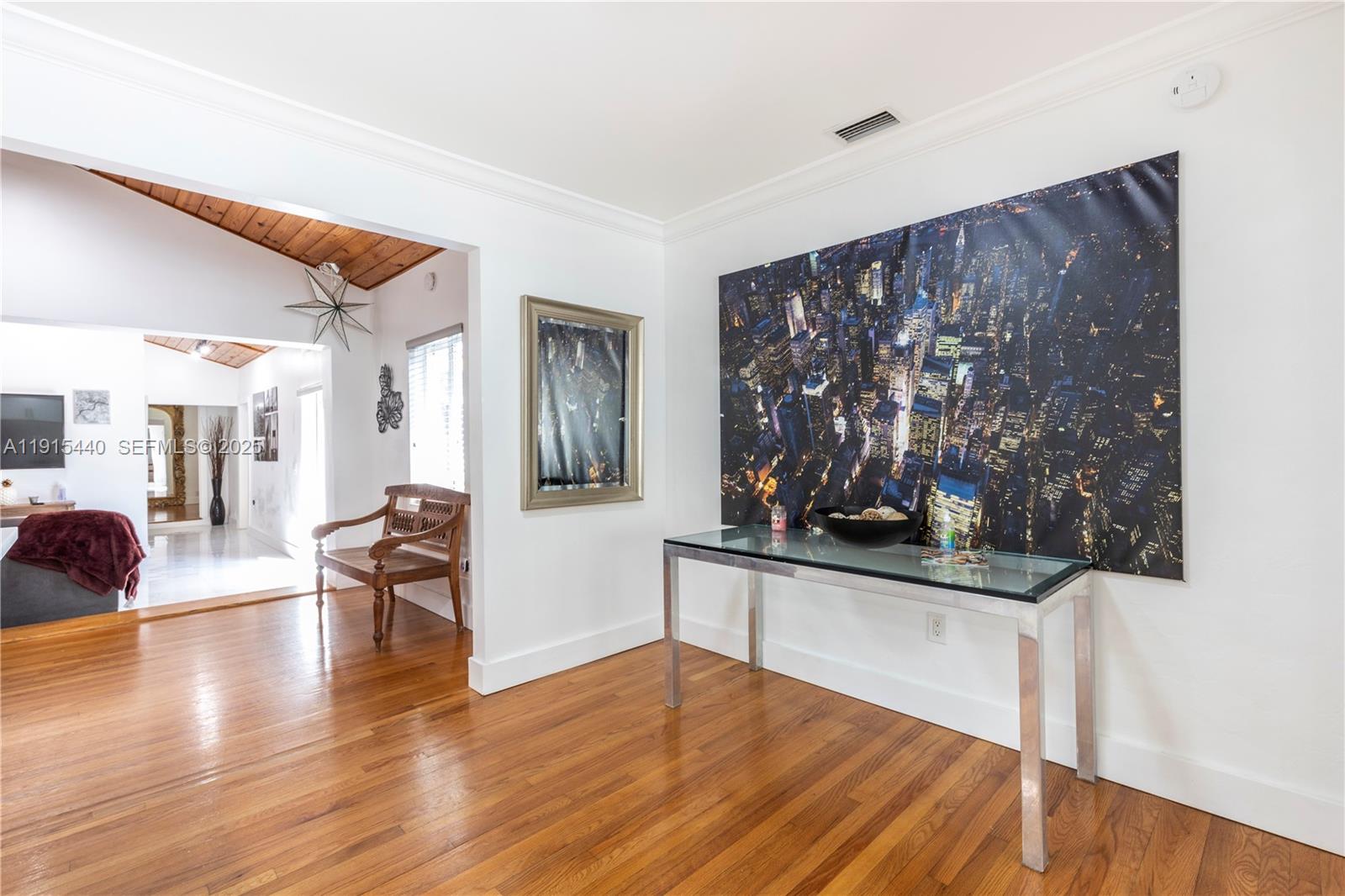 753 Northeast 81st Street Miami, FL 33138 - Photo 11 of 57 a living room with furniture and wooden floor