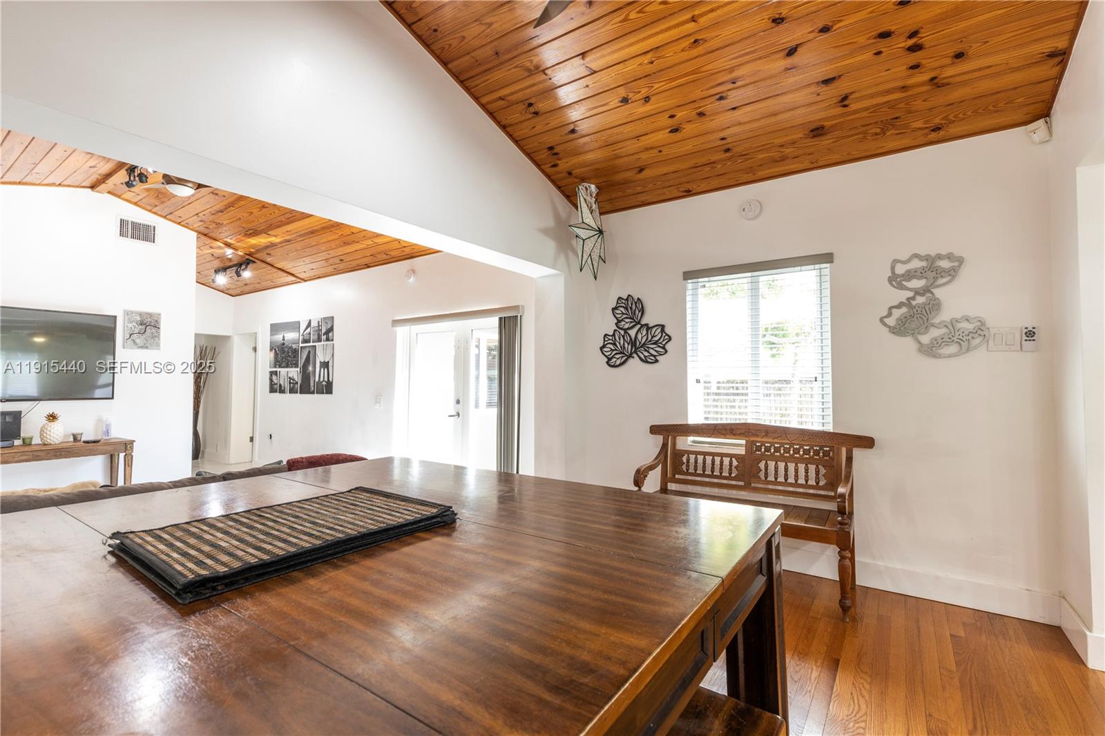 753 Northeast 81st Street Miami, FL 33138 - Photo 20 of 57 a living room with furniture rug and wooden floor