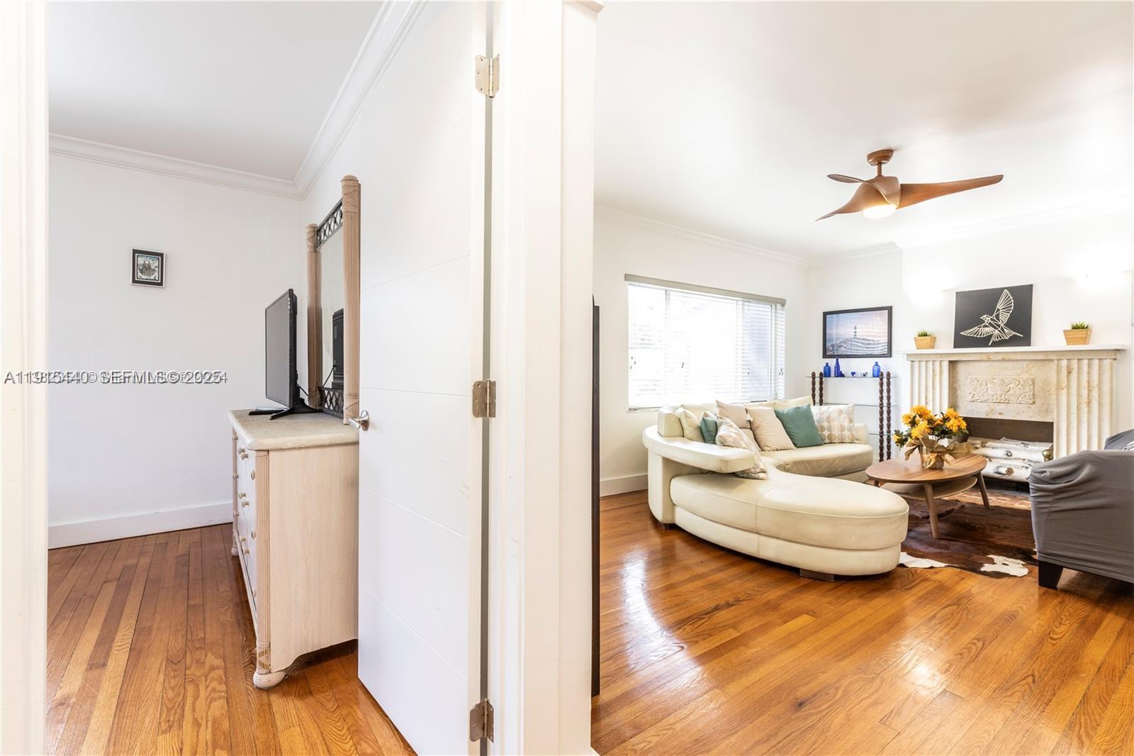 753 Northeast 81st Street Miami, FL 33138 - Photo 30 of 57 a living room with furniture and a flat screen tv