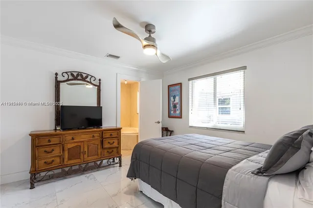 a bedroom with a bed and a table in it