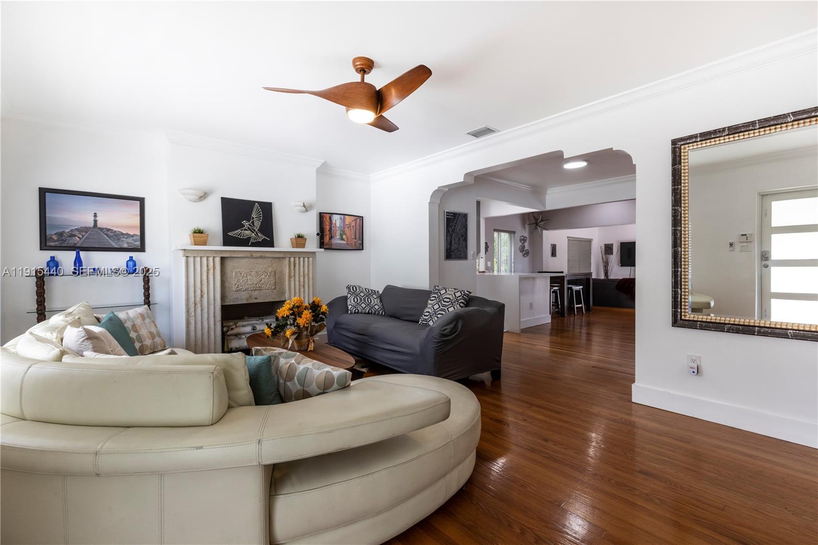753 Northeast 81st Street Miami, FL 33138 - Photo 4 of 57 a living room with furniture and a wooden floor