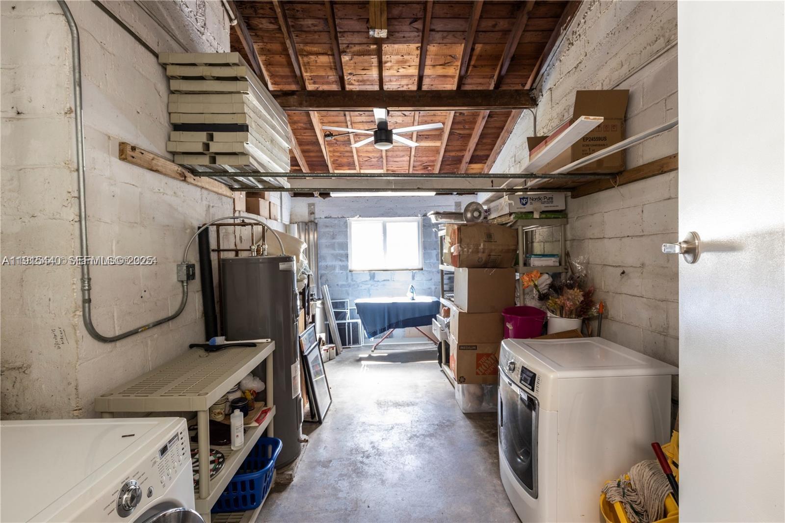 753 Northeast 81st Street Miami, FL 33138 - Photo 45 of 57 a utility room with dryer and washer