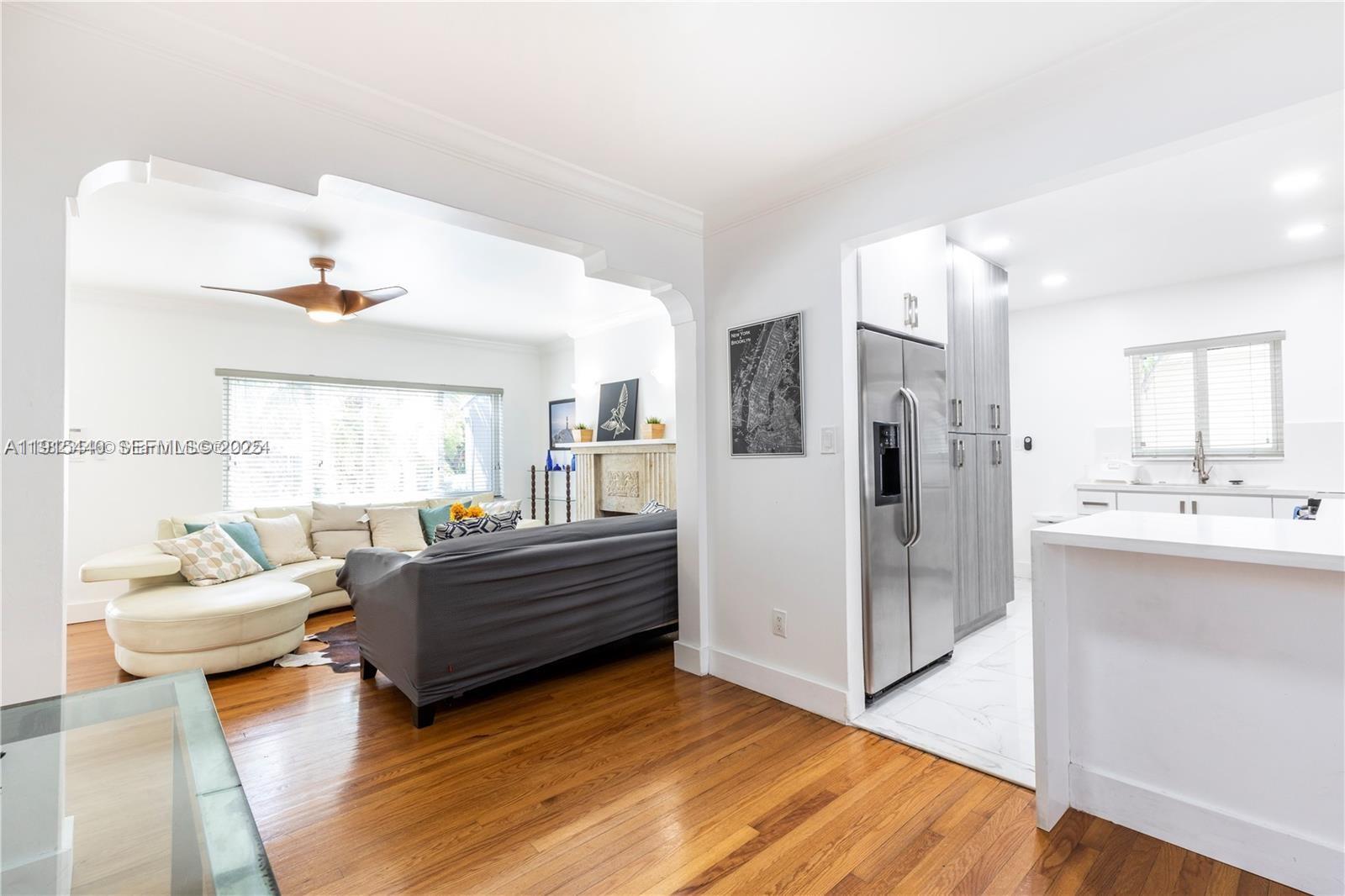 753 Northeast 81st Street Miami, FL 33138 - Photo 46 of 57 a living room with furniture and a kitchen