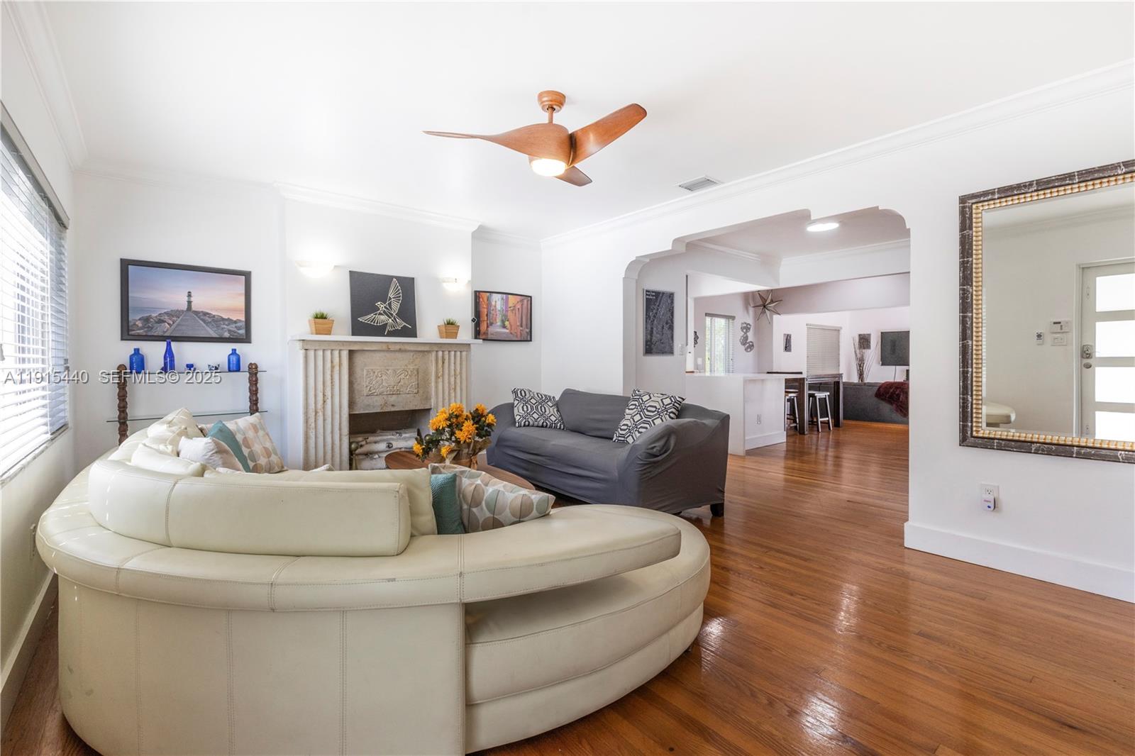 753 Northeast 81st Street Miami, FL 33138 - Photo 6 of 57 a living room with furniture and a wooden floor
