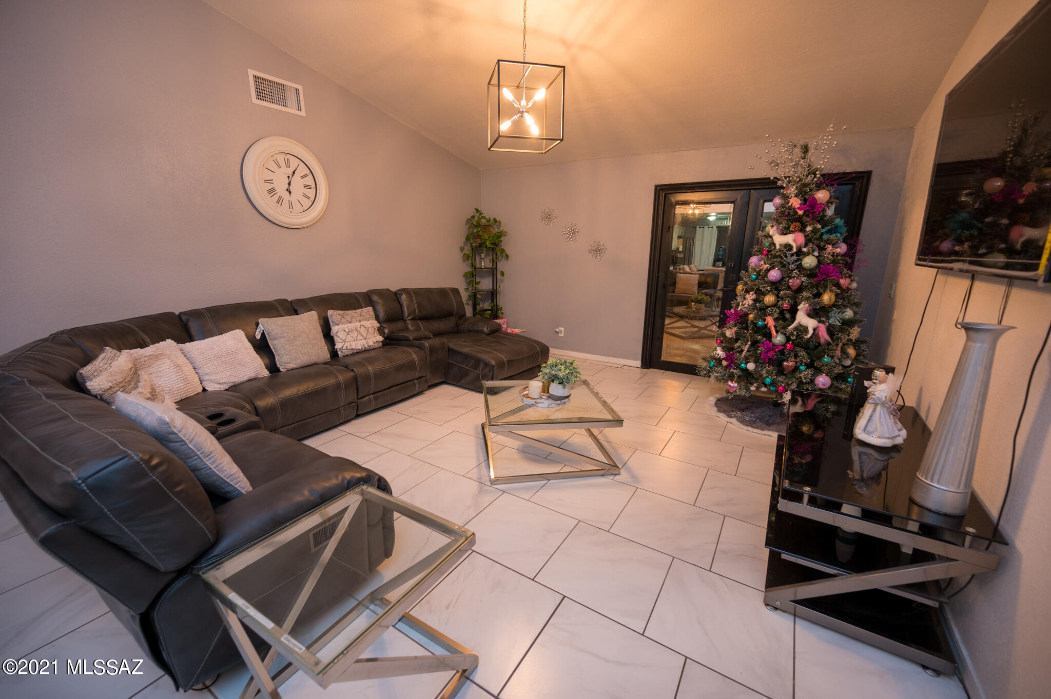 577 Camino Lito Galindo Rio Rico, AZ 85648 - Photo 12 of 19 a living room with furniture a flat screen tv and a table
