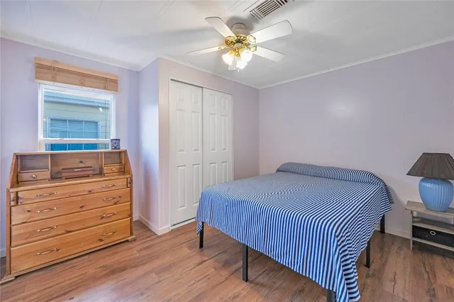 a bedroom with a bed and a dresser