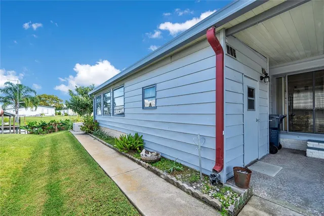 a view of a backyard with potted plants