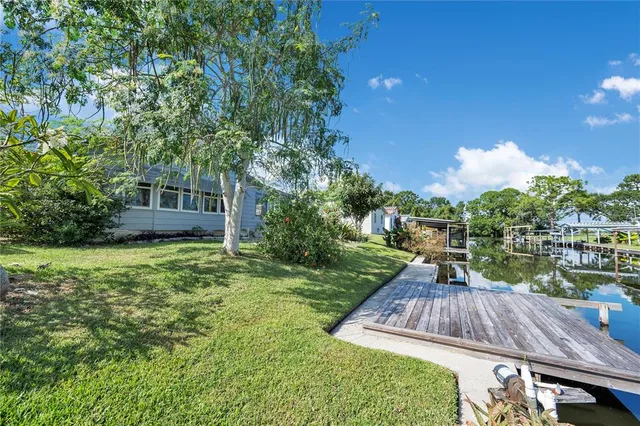 a view of a backyard with sitting area