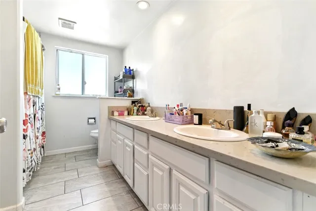 a bedroom with furniture and a gym equipment