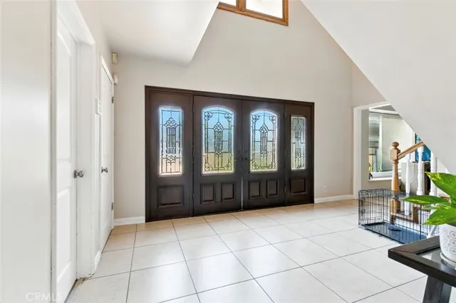 a view of entryway wih livingroom and stairs