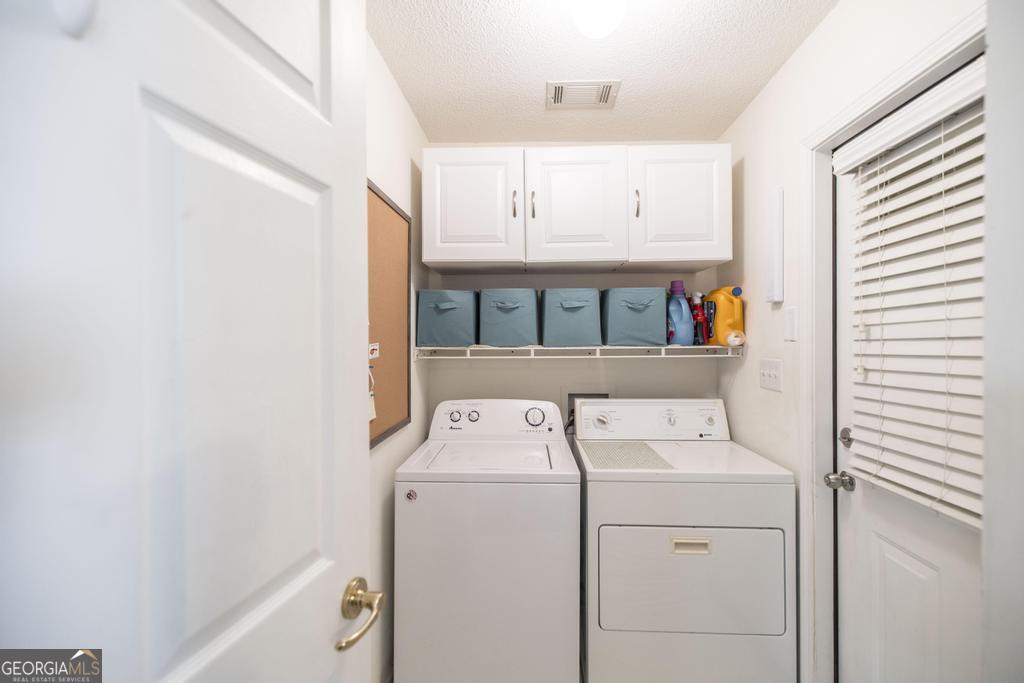216 South Houston Springs Boulevard Perry, GA 31069 - Photo 16 of 31 a utility room with dryer and washer
