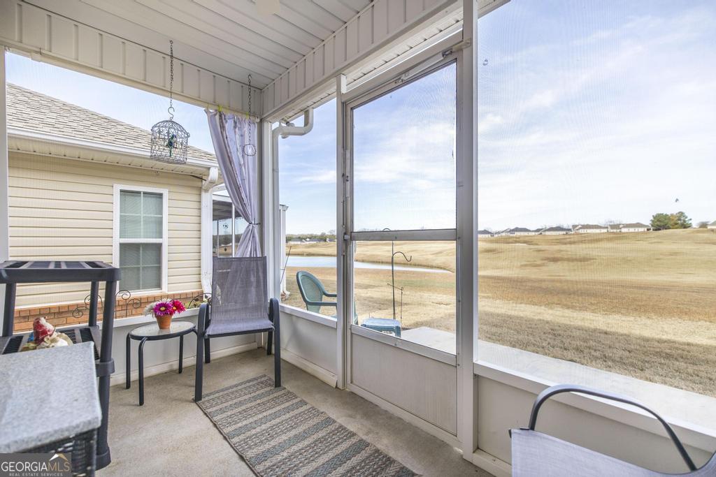 216 South Houston Springs Boulevard Perry, GA 31069 - Photo 25 of 31 a living room with furniture and floor to ceiling windows